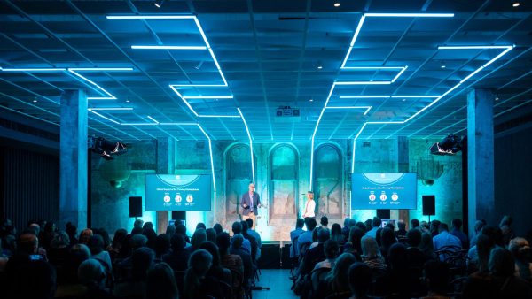 AV production for a corporate conference — stage lighting, screens and audio by AVE Sydney